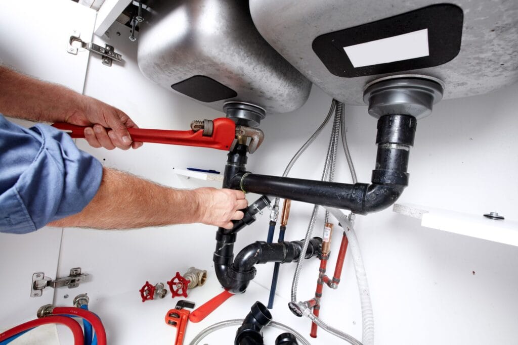 Venice Plumbing Pros fixing under sink plumbing and drain pipes