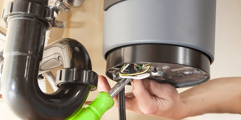 Venice, Florida plumber servicing water heater pipe connection