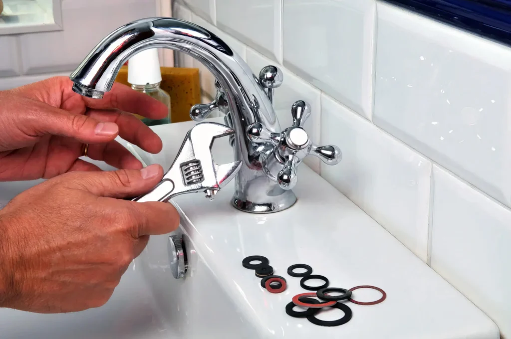 Plumber performing maintenance on a bathroom faucet in Venice