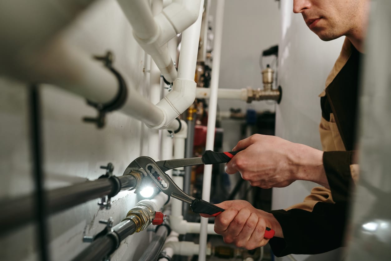 Plumbers maintaining commercial plumbing pipes in Venice