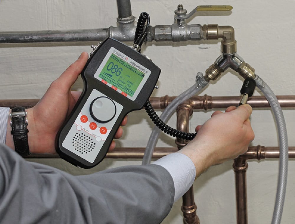 Plumber testing pipes with electronic leak detection equipment in Venice